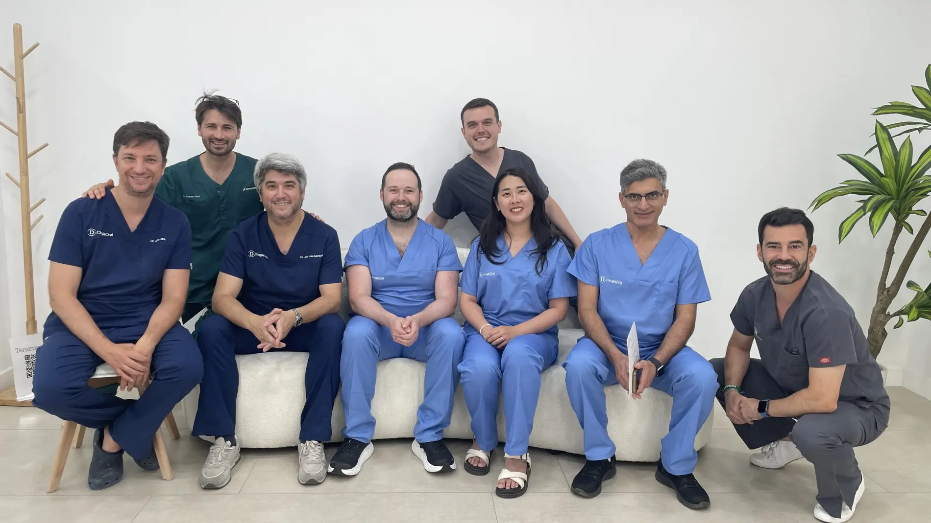 Participants operating on real patients during a live implant course